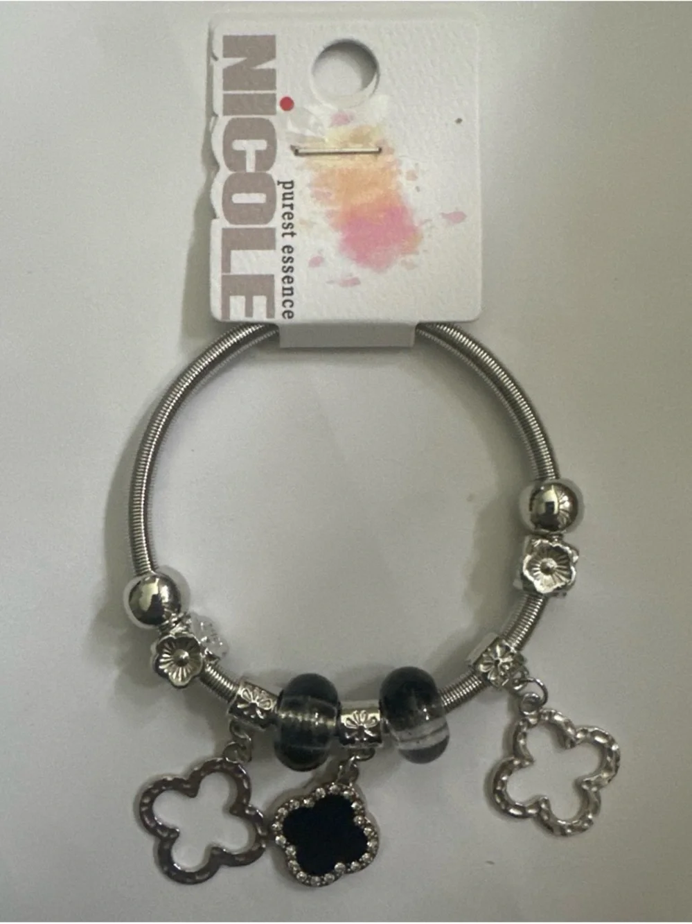 Nicole Silver-Tone Bracelet with Black and Clear Charms